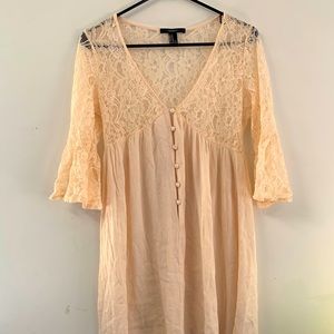 Flowy blush dress with lace top and sleeves